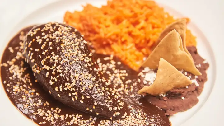 Indulge in the rich, complex flavors of homemade Mole Poblano with this authentic recipe. Dive into the depths of Mexican cuisine with this delectable delight!